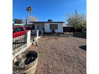Single story home with gravel yard and small fence at 39 E Pacific Ave, Henderson, NV 89015