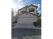 Two-story home with attached garage and landscaping at 9617 Pine River Ln, Las Vegas, NV 89123