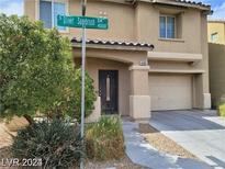 Two-story house with attached garage and landscaping at 4085 Oliver Sagebrush Dr, Las Vegas, NV 89122