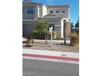 Two-story house with landscaping and a for sale sign at 5501 Wells Cathedral Ave, Las Vegas, NV 89130