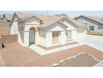 One story home with light colored exterior and 2 car garage at 2847 Cattail Cove St, Laughlin, NV 89029