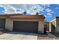 Spanish style home with attached garage and gated entry at 4453 Alto Verde Dr, Las Vegas, NV 89119