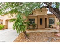 One-story home with desert landscaping and attached garage at 8225 Romantic Sunset St, Las Vegas, NV 89131