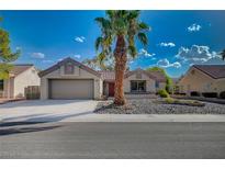 Single story home with a single car garage and desert landscaping at 8753 Sundial Dr, Las Vegas, NV 89134