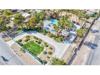 Aerial view of a house with pool and landscaping at 3784 Pama Ln, Las Vegas, NV 89120