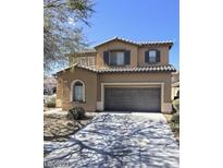 Two story home with attached garage and landscaping at 5217 Grand Lake St, North Las Vegas, NV 89081
