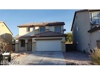 Two story house with attached garage at 3208 Aspinwall Ct, North Las Vegas, NV 89081