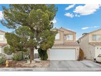 Two-story house with attached garage and mature tree at 2208 Saint Paul Way, Las Vegas, NV 89104