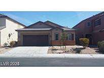One story home with brown garage door at 5116 Blue Rose St, North Las Vegas, NV 89081