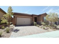 Single-story home with two-car garage and desert landscaping at 485 Pebble Run Ave, Henderson, NV 89011