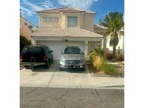 Two-story house with attached garage and landscaping at 8008 Dover Shores Ave, Las Vegas, NV 89128