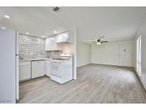 Bright, updated kitchen with white cabinets and modern appliances at 5187 Caliente St # 96, Las Vegas, NV 89119