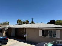 House exterior with a tan facade and a neat lawn at 2315 Beverly Way, Las Vegas, NV 89104