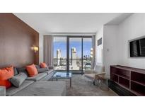 Spacious living room with city views and modern decor at 4381 W Flamingo Rd # 20320, Las Vegas, NV 89103