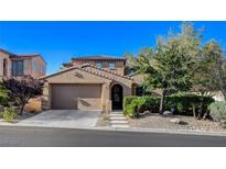 Two story home with attached garage and landscaped yard at 12116 Montura Rosa Pl, Las Vegas, NV 89138