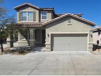Two-story house with attached garage and neutral color scheme at 6709 Brick House Ave, Las Vegas, NV 89122