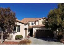 Two-story house with a two-car garage and landscaping at 1700 Ravanusa Dr, Henderson, NV 89052
