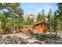 Rustic log cabin nestled in a mountain setting at 2130 Via Spes Nostra St, Mount Charleston, NV 89124