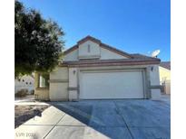 Single-story home with attached two-car garage at 5713 Lawrence St, North Las Vegas, NV 89081