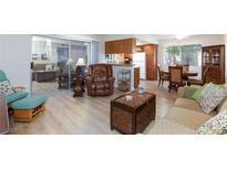 Living room with leather recliner and wood floors at 7200 Pirates Cove Rd # 1093, Las Vegas, NV 89145