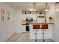 Updated kitchen with stainless steel appliances and breakfast bar at 1361 E University Ave # 111, Las Vegas, NV 89119