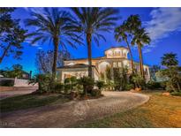 Luxury home with palm trees and a brick driveway at 2349 Villandry Ct, Henderson, NV 89074