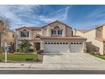 Two-story house with three-car garage,landscaped lawn, and a stucco exterior at 23 Antero Dr, Henderson, NV 89074