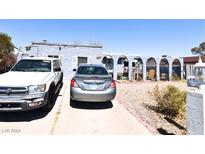 House exterior with carport and landscaped yard at 3980 Placita Ave, Las Vegas, NV 89121