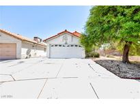 Single-story house with attached garage and driveway at 5438 Beaverhead Dr, Las Vegas, NV 89120