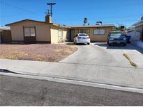 Single-story house with a driveway and landscaping at , Las Vegas, NV 89107
