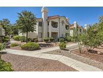 Two story building exterior with landscaping and walkway at 7900 Ryandale Cir # 201, Las Vegas, NV 89145