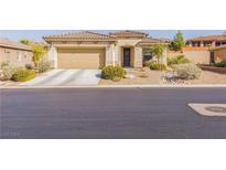 Single-story house with beige exterior and attached garage at 177 Spyglass Way, Mesquite, NV 89027