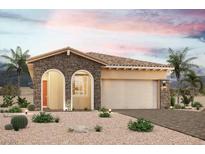 Single-story home with stone accents and a two-car garage at 111 Barkset Way, Henderson, NV 89011