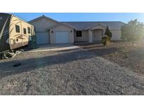 Single-story house with RV parking and gravel driveway at 2881 Acoma Ave, Pahrump, NV 89048