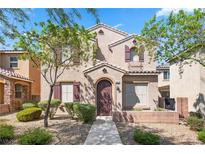 Two-story house with a landscaped yard and attached garage at 10928 Mount Stellar St, Las Vegas, NV 89179