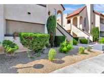 Exterior view of a Spanish-style building with landscaping at 1751 E Reno Ave # 132, Las Vegas, NV 89119