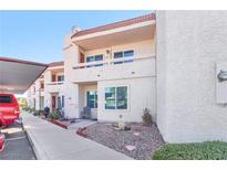 Exterior view of condo with walkway and landscaping at 687 Marina Dr # 43, Boulder City, NV 89005