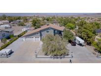 Aerial view of a two-story house with a large driveway and RV parking at 836 San Eduardo Ave, Henderson, NV 89002