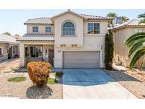 Two-story house with light beige exterior at 6229 Peach Orchard Rd, Las Vegas, NV 89142