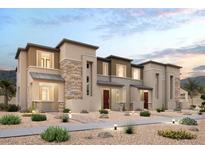 Modern three-story townhome with stone accents at 196 Freeport View Pl, Henderson, NV 89011