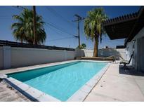 Private pool with surrounding patio and palm trees at 1309 Riverside Dr, Las Vegas, NV 89106