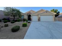 Single-story house with three-car garage and landscaped front yard at 6064 Alpine Estates Cir, Las Vegas, NV 89149