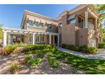 Two-story home with a covered entryway, landscaping, and a two-car garage at 801 Dana Hills Ct # 102, Las Vegas, NV 89134