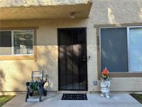 Inviting condo entry with security door and garden at 2253 Short Pine Dr # 0, Las Vegas, NV 89108