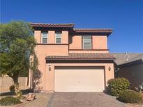 Two-story house with attached garage and neutral color exterior at 720 Oak Hills Course Dr, Las Vegas, NV 89148