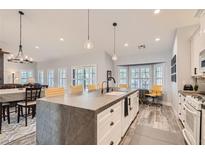 Modern kitchen with large island and white cabinets at 5601 Cavalier Cir, Las Vegas, NV 89130