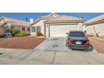 Charming single-story home with a well-manicured front yard and a two-car garage at 4449 Cielo Ln, Las Vegas, NV 89130