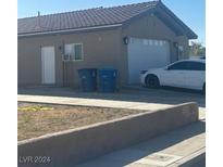 House exterior showing garage and driveway at 1840 Princeton St, North Las Vegas, NV 89030