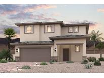 Two-story house with a beige exterior and three-car garage at 851 Metromont Ct, Henderson, NV 89011