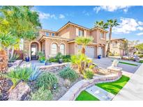 Two-story house with landscaped yard and three-car garage at 127 Birch Ridge Ave, Las Vegas, NV 89183